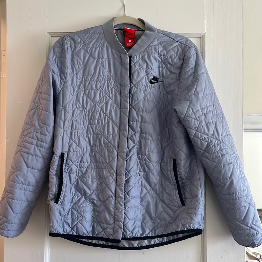 Blue Nike athletic jacket